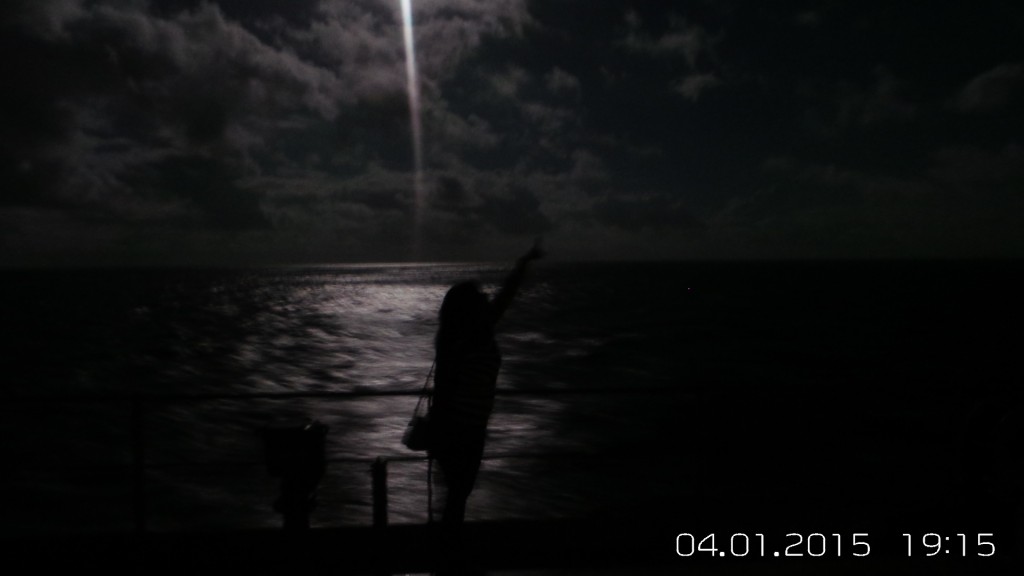 Admiring the moon on ocean